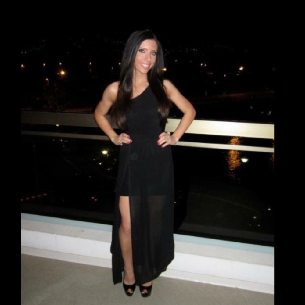 One shoulder bodycon black dress with sheer skirt.